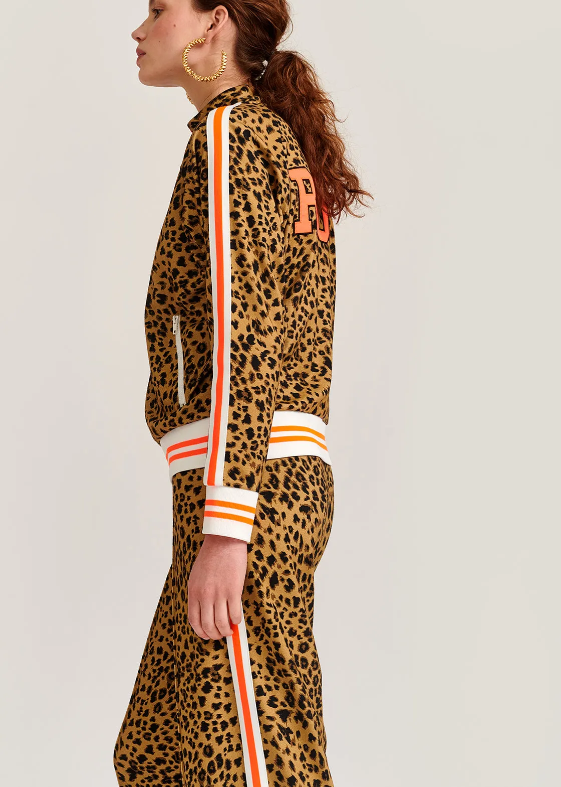 Leopard-print track jacket with 'riot' slogan