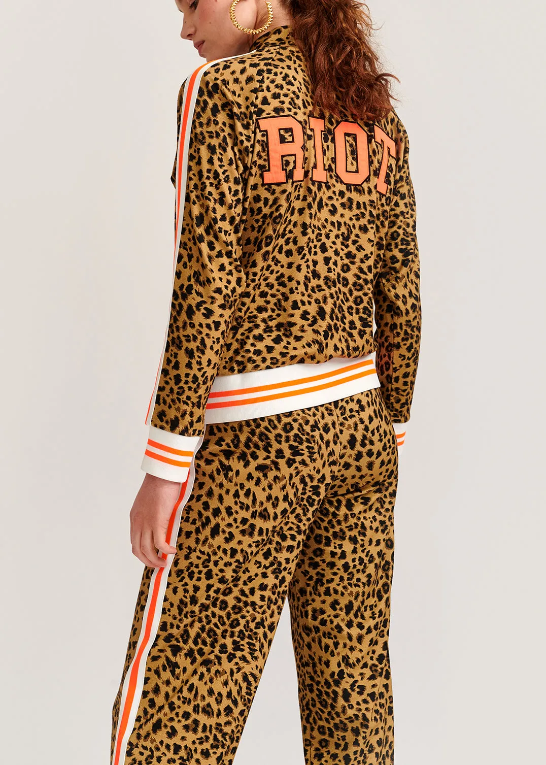 Leopard-print track jacket with 'riot' slogan