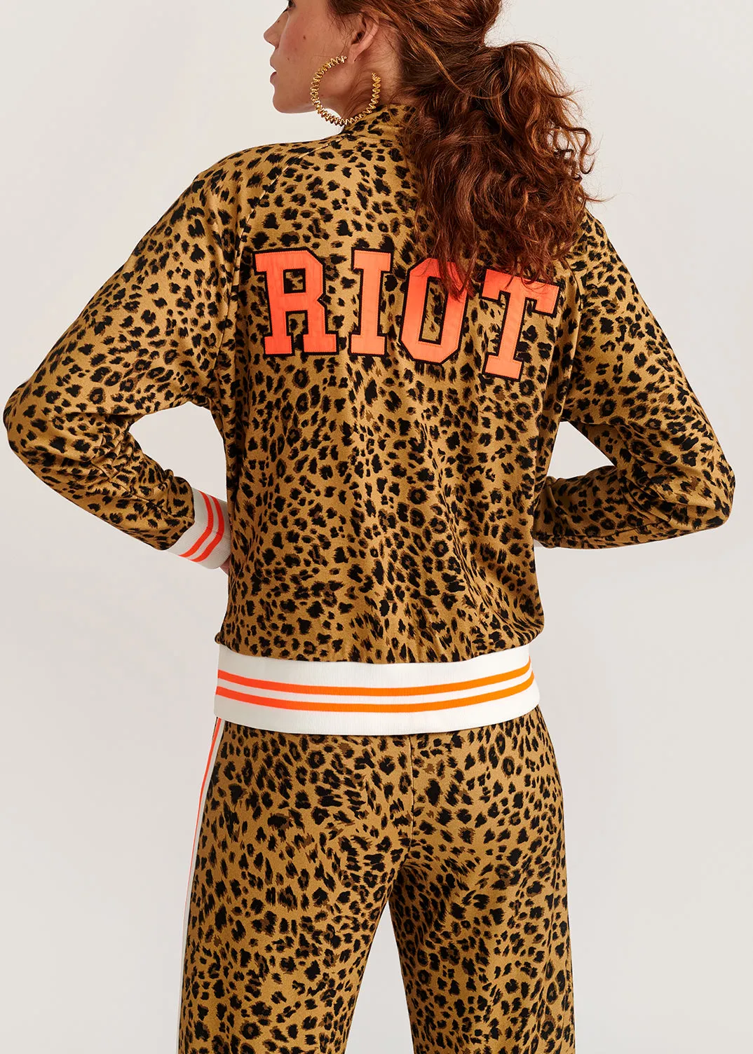 Leopard-print track jacket with 'riot' slogan